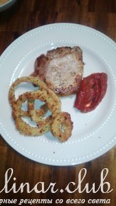 Pork steak and onion rings      