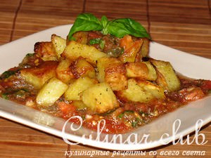        (Patate arrostite con pomodori marinati)