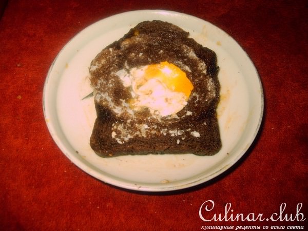 Fry egg in a black bread.     . 